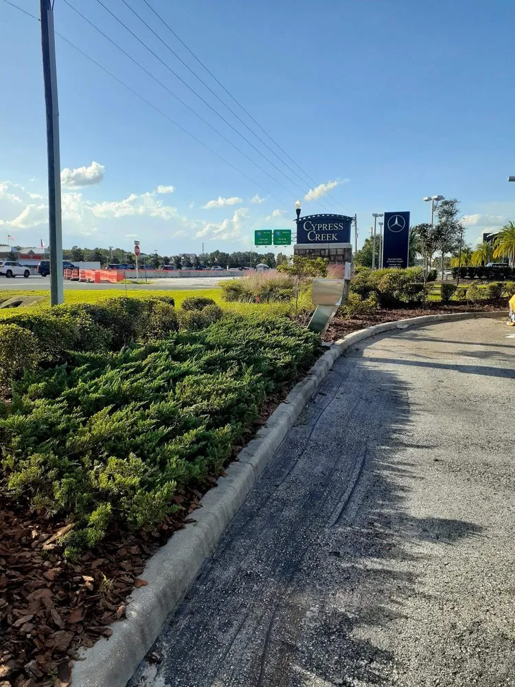 Local lawn mowing service with custom design across Masaryktown, FL - Ecstatic Landscaping