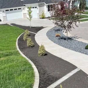 Custom residential landscaping for outdoor upgrades in Hyde Park, UT by Edge Pro Decorative Landscape Curbing