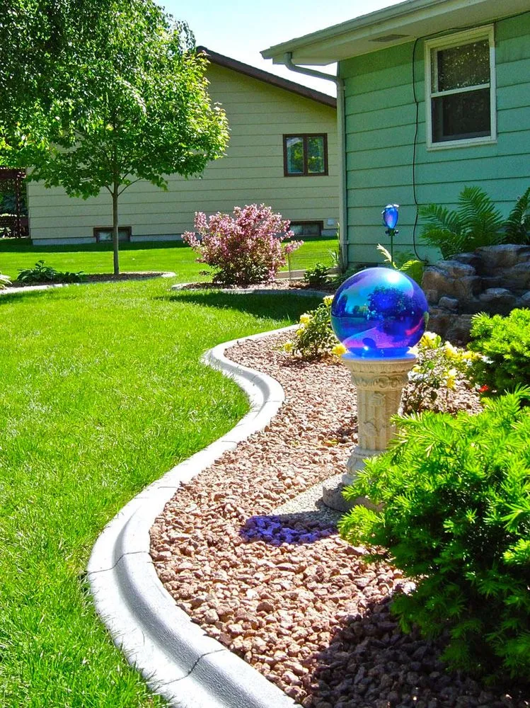 Affordable lawn mowing service with custom design in Sioux Falls, SD by Edge Pros