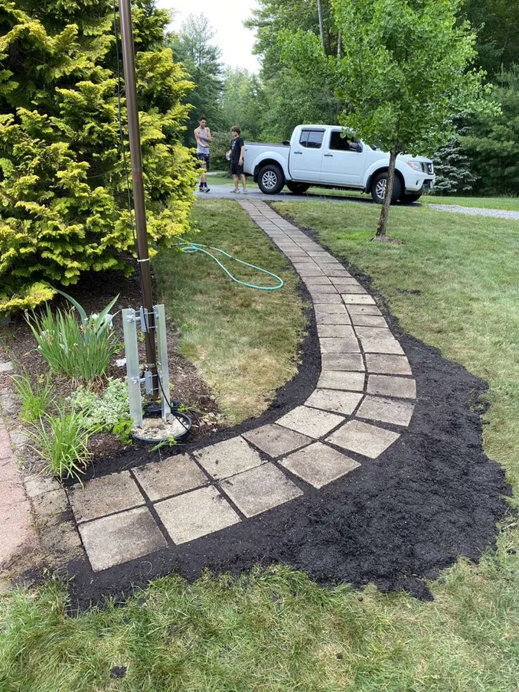 Professional lawn mowing service for homes in Merrimack, NH by EDI Landscaping And Physical Services