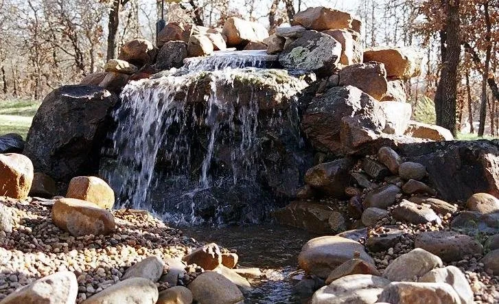 Reliable lawn care service for residential properties in Edmond, OK by Edmond Landscapes