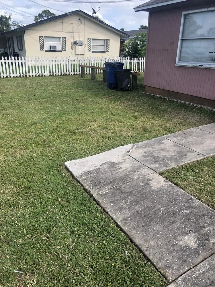 Professional lawn care service for year-round maintenance in Lehigh Acres, FL by Edouard’s landscaping