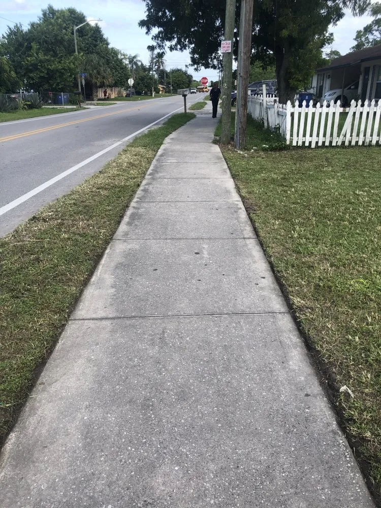 Affordable lawn mowing service for residential properties in Lehigh Acres, FL by Edouard’s landscaping