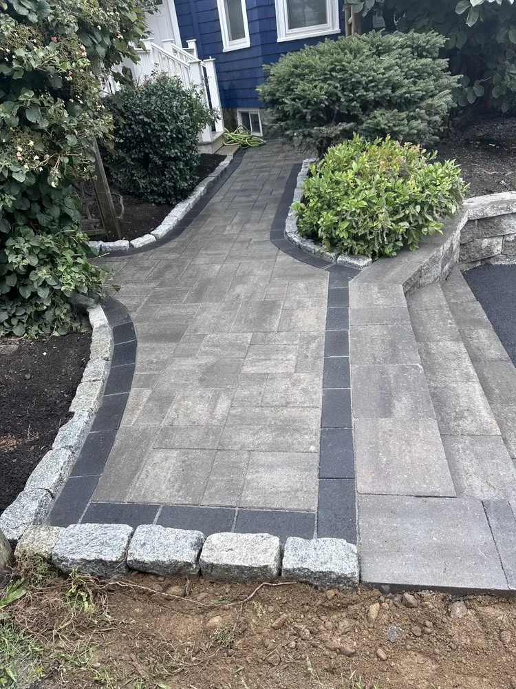 Affordable yard cleanup service with custom design in Lynn, MA by Eduardo's Construction & Paving