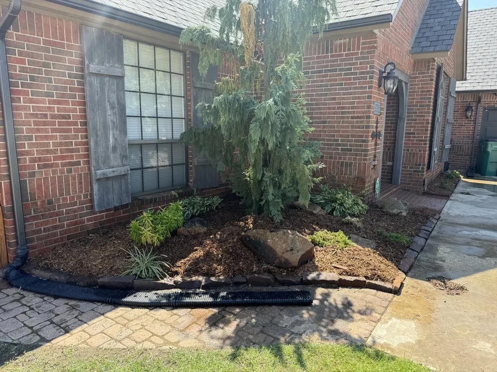 Custom landscape design with custom design in Oklahoma City, OK by Elite Concrete And Landscaping