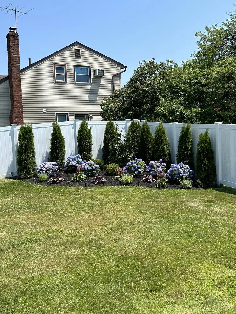 Custom garden landscaping with custom design across West Sayville, NY - Elite Landscaping & Maintenance