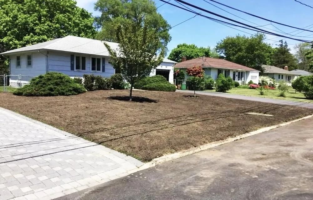 Expert lawn mowing service for homes in West Sayville, NY by Elite Landscaping & Maintenance