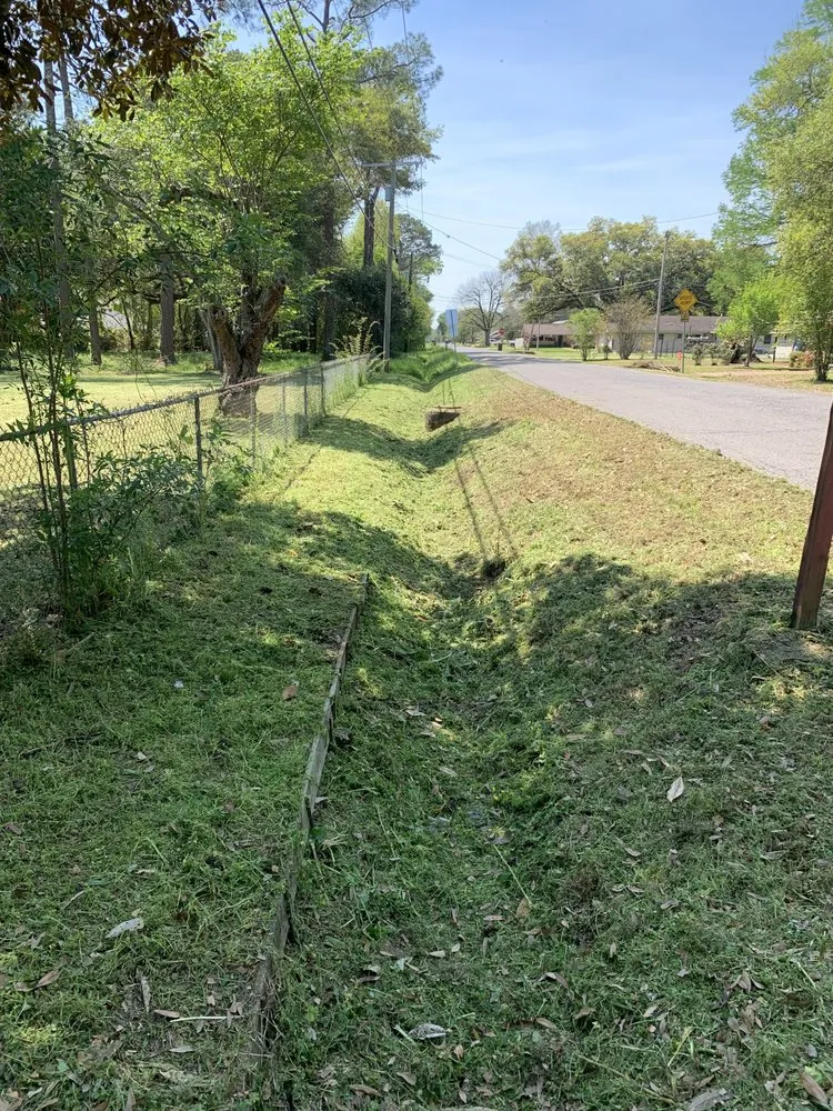 Custom landscape installation for residential properties in Ball, LA by Elite Lawn Solutions