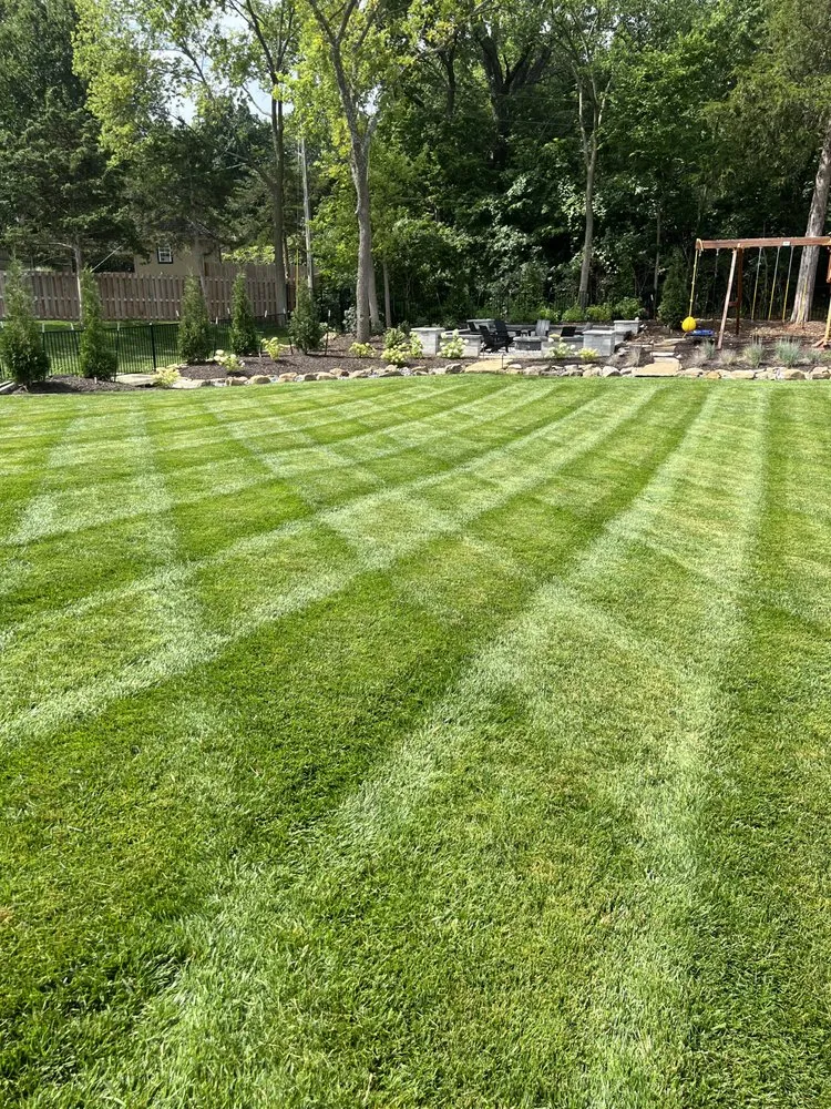 Professional outdoor landscaping for residential properties in Kansas City, KS by Elite Mowing And Services