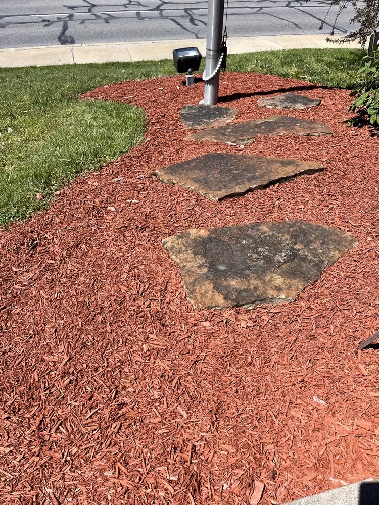 Custom landscape installation in West Terre Haute, IN by Elite Property Services