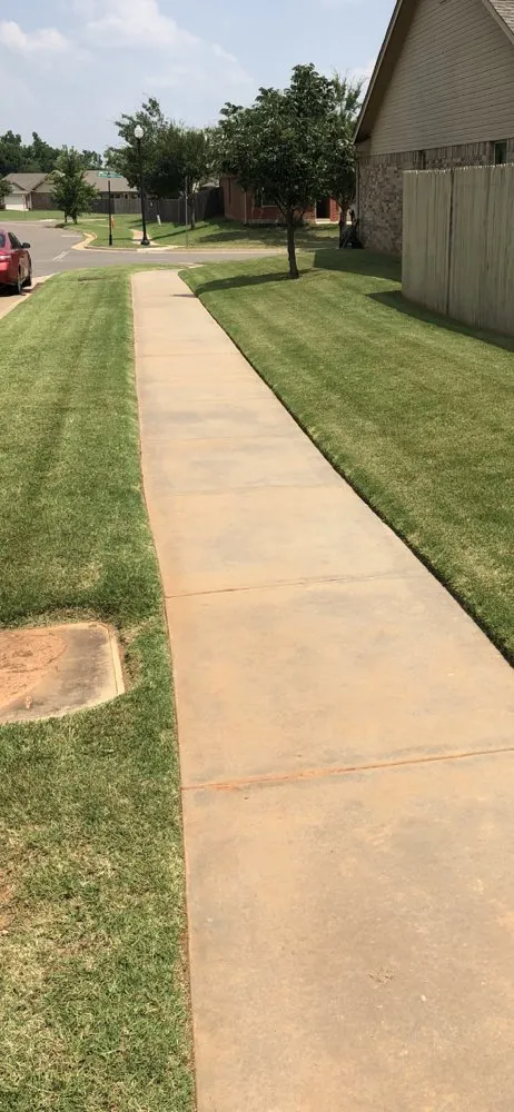 Expert yard maintenance for homes in Yukon, OK by Elkins Lawncare and Landscape