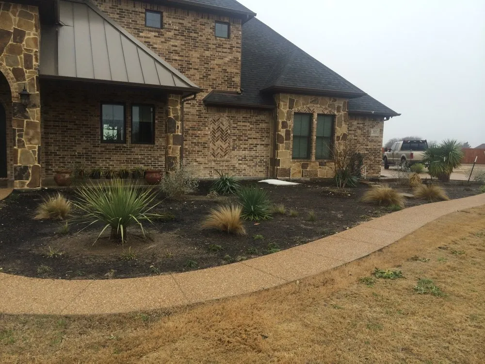 Custom landscaping services for year-round maintenance in Waxahachie, TX by Ellis County Lawn & Landscape