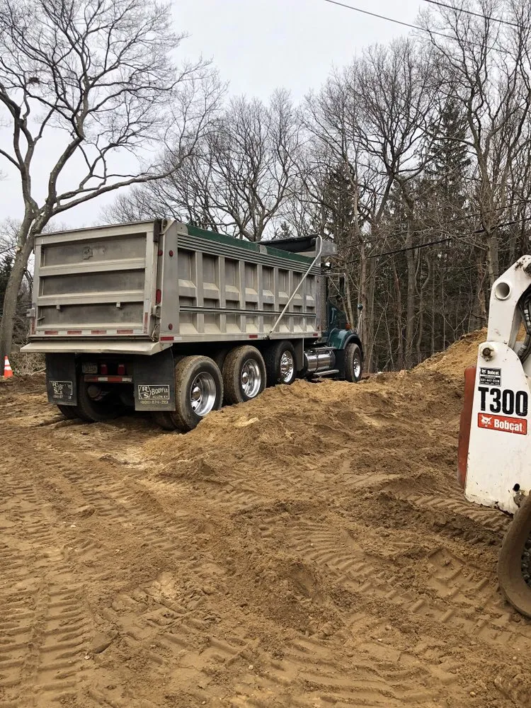 Reliable yard cleanup service for beautiful yards in Bayport, NY by ELM Excavating
