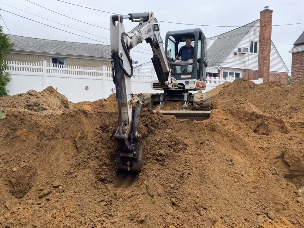 Affordable lawn care service for year-round maintenance in Bayport, NY by ELM Excavating