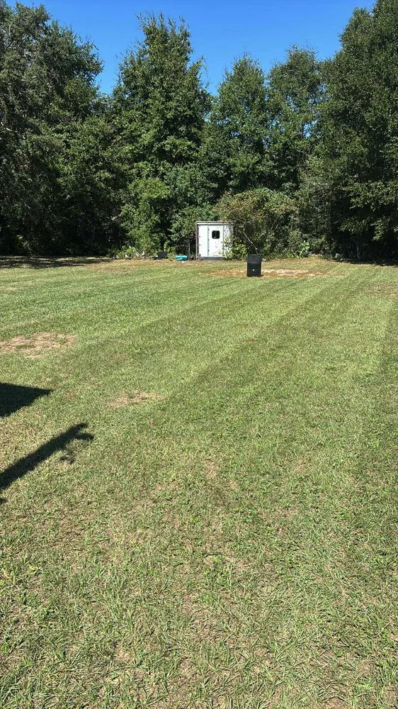 Custom lawn mowing service with custom design in Milton, FL by Emerald Coast Fencing