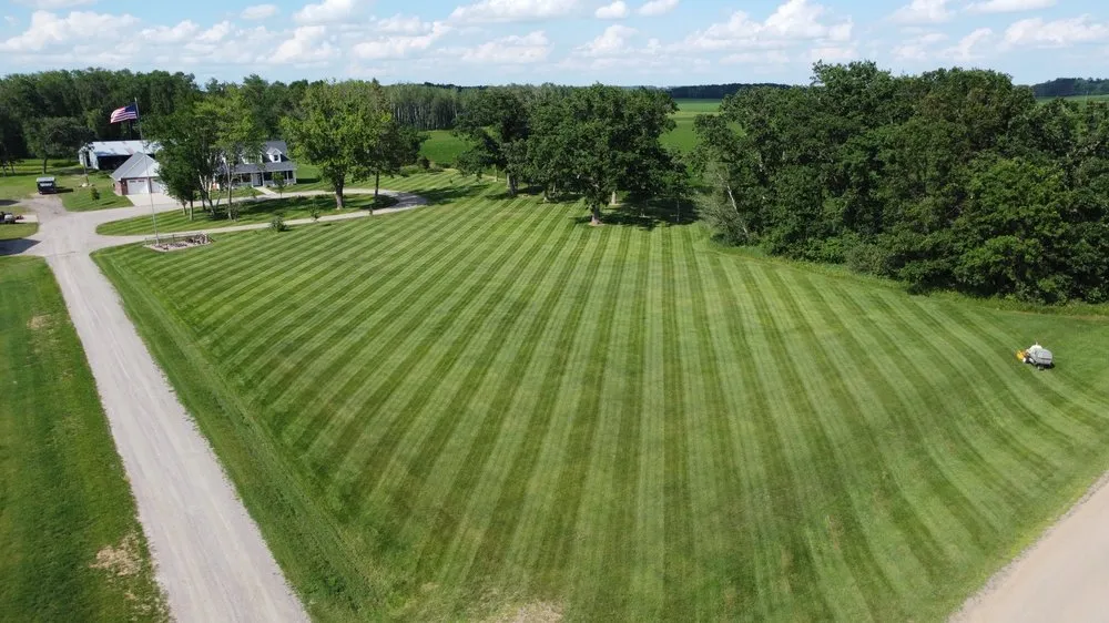 Professional yard cleanup service for homes in Waite Park, MN by Emerald Companies