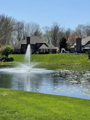 Emerald Green Lawn Care Logo