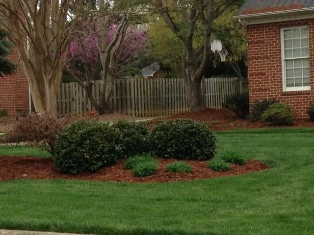 Custom lawn mowing service with custom design across Whitsett, NC - Emerald Green