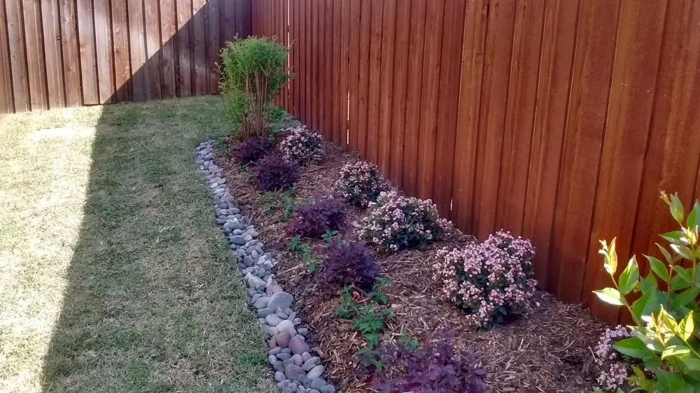 Reliable lawn mowing service for residential properties in Garland, TX by Emerald Lake Landscaping