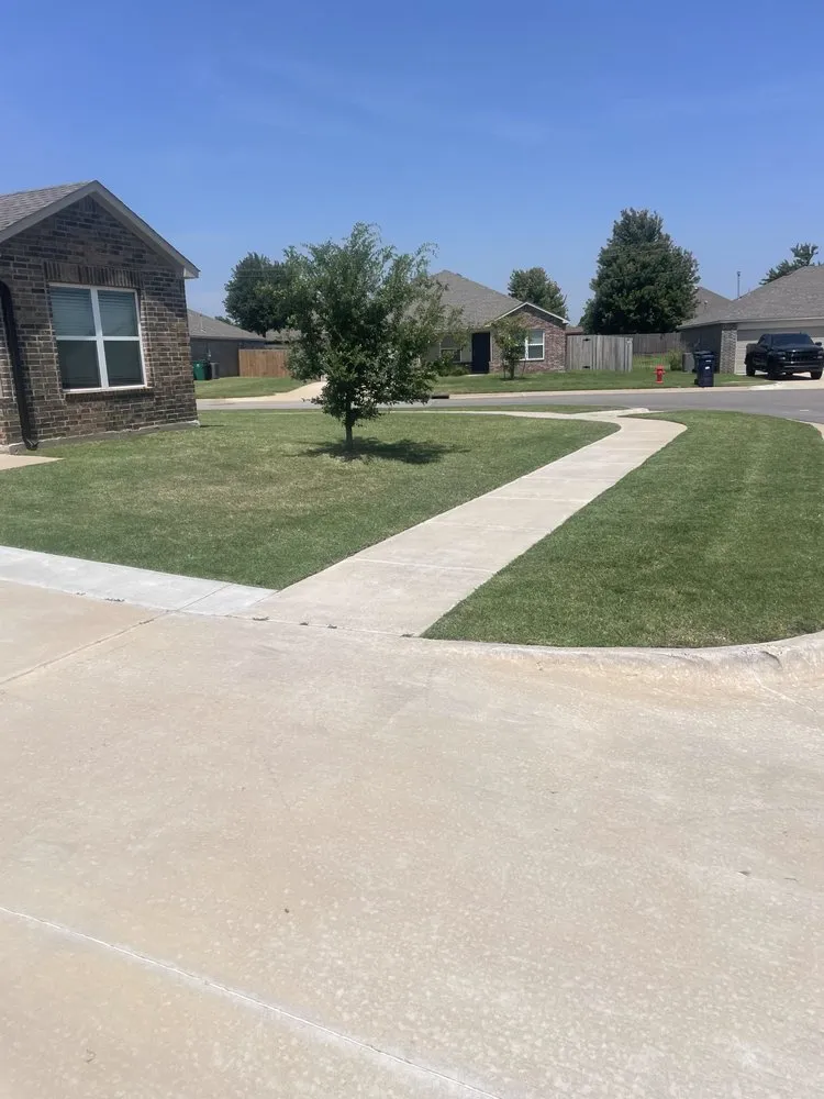 Affordable landscape design for year-round maintenance in Newcastle, OK by Emerge Lawns