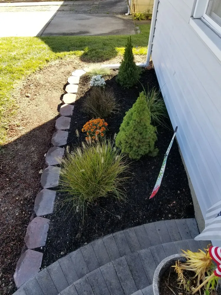 Trusted lawn mowing service with custom design in Bayport, NY by Emergency Cut N Trim