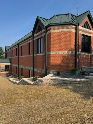 Emrick Outdoor Maintenance Logo