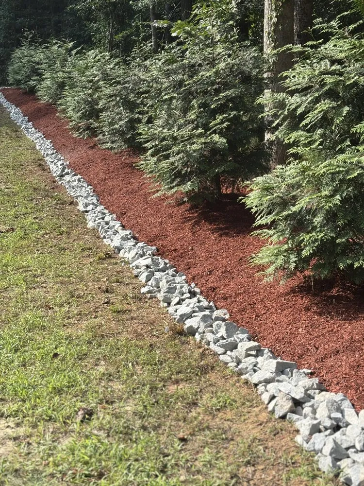 Custom landscape installation for beautiful yards in Clayton, NC by Enchanted Garden’s Landscaping