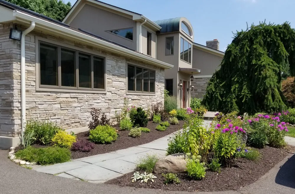 Top-rated yard maintenance for residential properties in Enfield, CT by Encore Landscaping