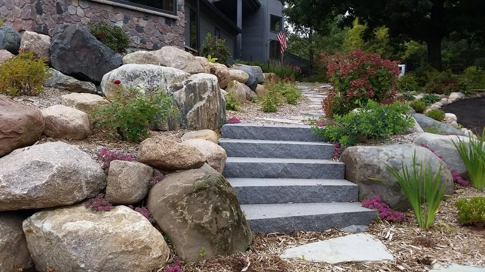 Affordable lawn mowing service for year-round maintenance in Hudson, WI by Environmental Landscape Management