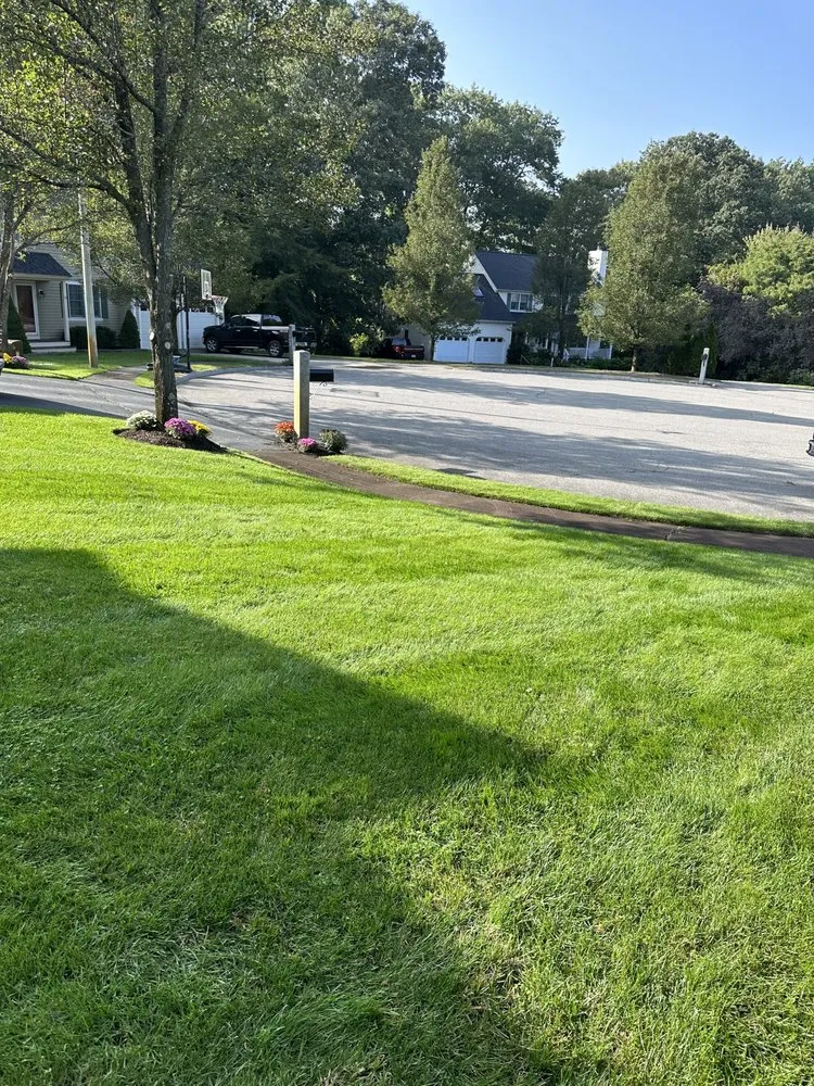 Custom lawn care service for residential properties in Waltham, MA by Erick Landscaping