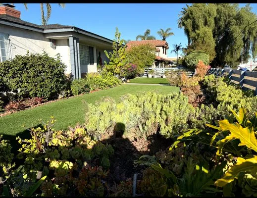 Ernesto Reyes Landscaping And Junk Removal Logo