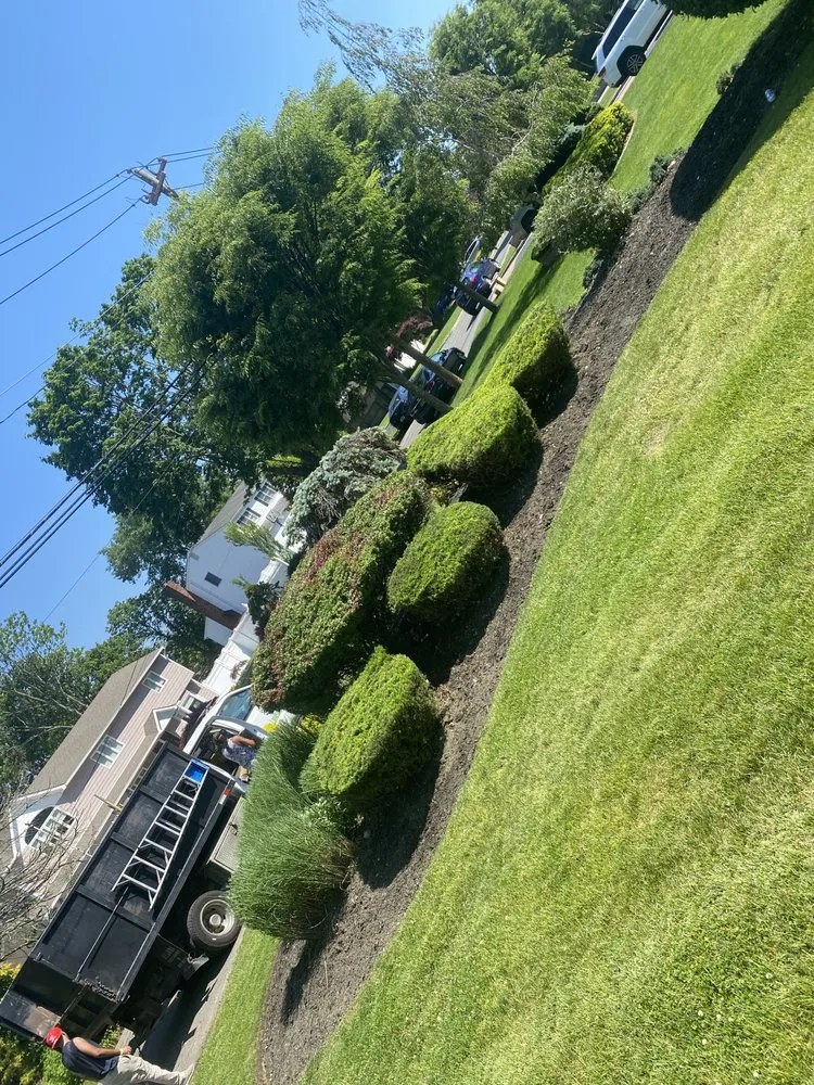 Professional yard maintenance for residential properties in Amityville, NY by Estrada & Sons Landscaping