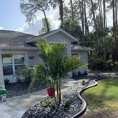 Local landscape design with custom design in Port Charlotte, FL by Estrada Lawn Service & Concrete Curbing