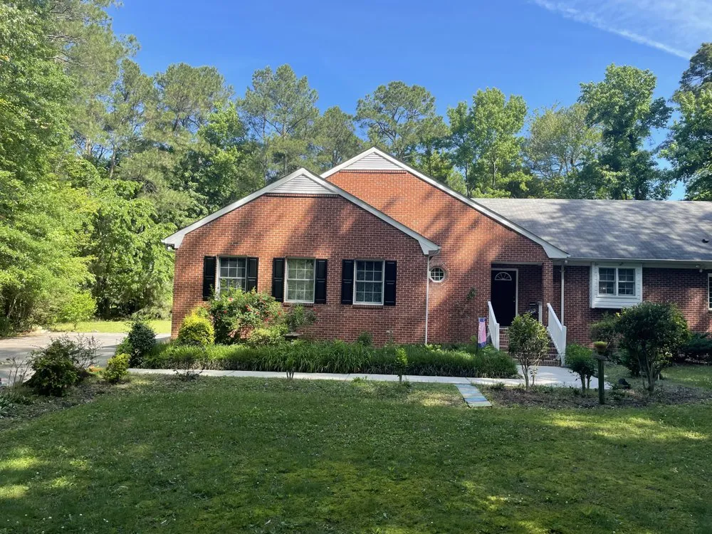 Professional landscape installation with custom design in Tappahannock, VA by Evan's Fence and Grass