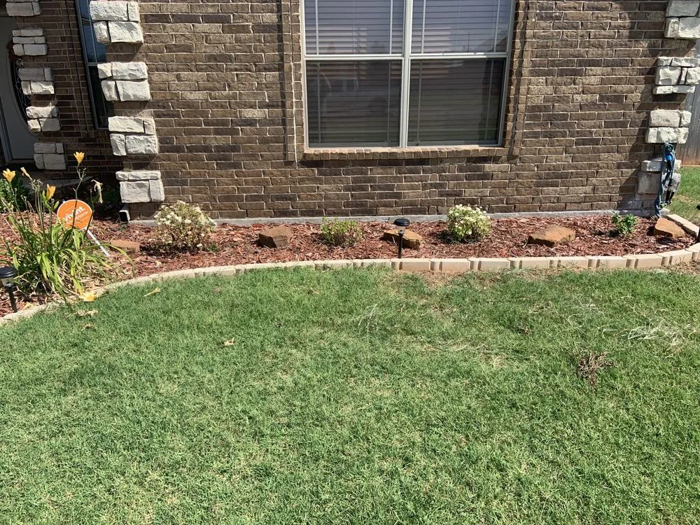 Professional lawn care service for residential properties in Fletcher, OK by Evergreen Custom Landscaping