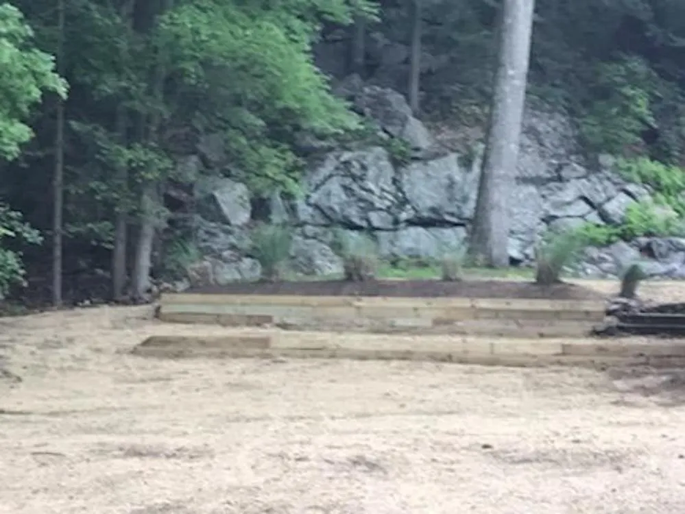 Professional yard cleanup service for year-round maintenance in Shelton, CT by Evergreen Garden Design