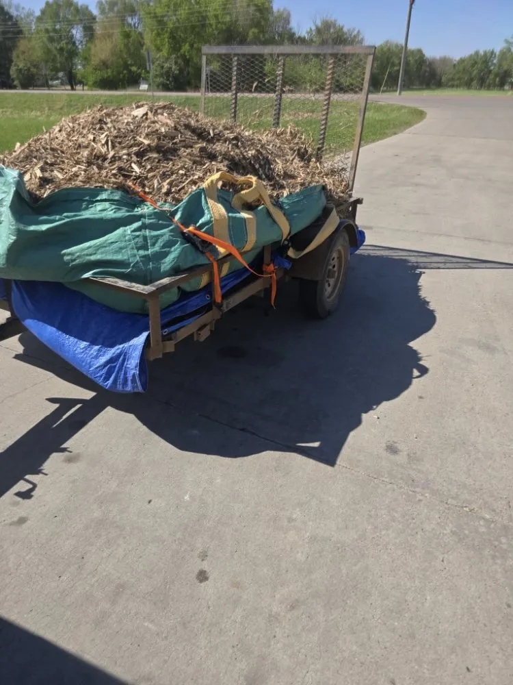 Custom landscape installation for beautiful yards in Sioux Falls, SD by Evlos Property Maintenance
