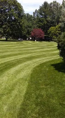 Exceed Lawn Care Logo