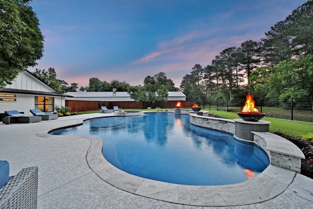 Local yard cleanup service for year-round maintenance in Cypress, TX by Expression Custom Pools
