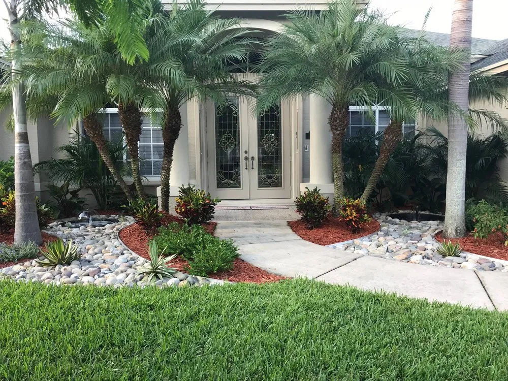 Custom landscape design for residential properties in Palm Bay, FL by Exquisite Lawn Maintenance
