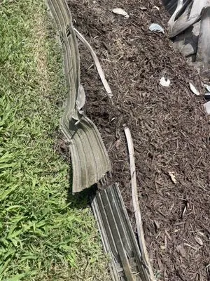 Extra Mile Lawn Care Logo