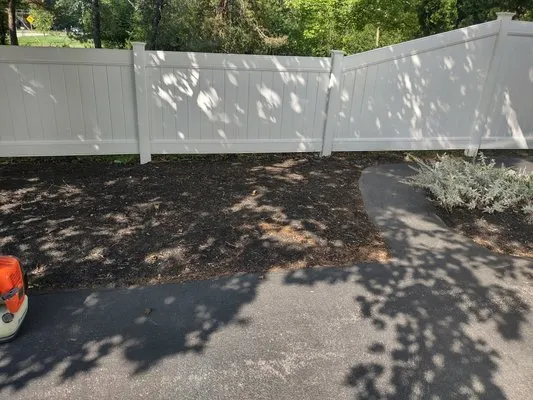 Extraordinaire Landscape and Lawn Care Logo