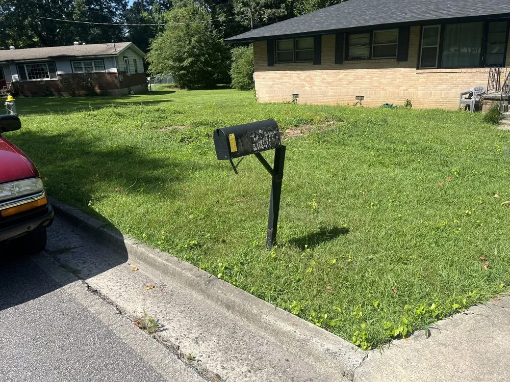 Reliable yard maintenance for residential properties in Forest Park, GA by Eye Candy Lawn Care Services