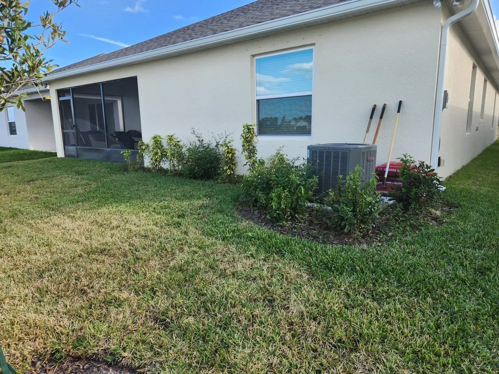 Custom residential landscaping for year-round maintenance in Palm Bay, FL by EZ does it lawn care