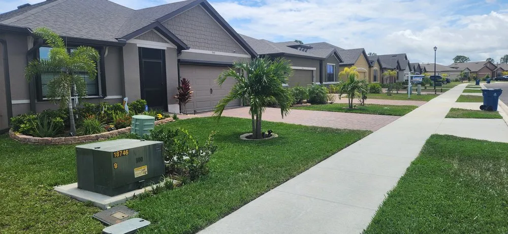 Trusted lawn care service near you across Palm Bay, FL - EZ does it lawn care