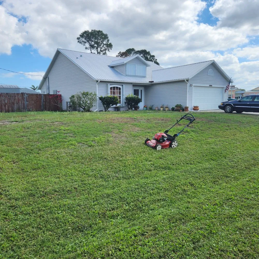 Top-rated lawn care service experts serving Palm Bay, FL - EZ does it lawn care