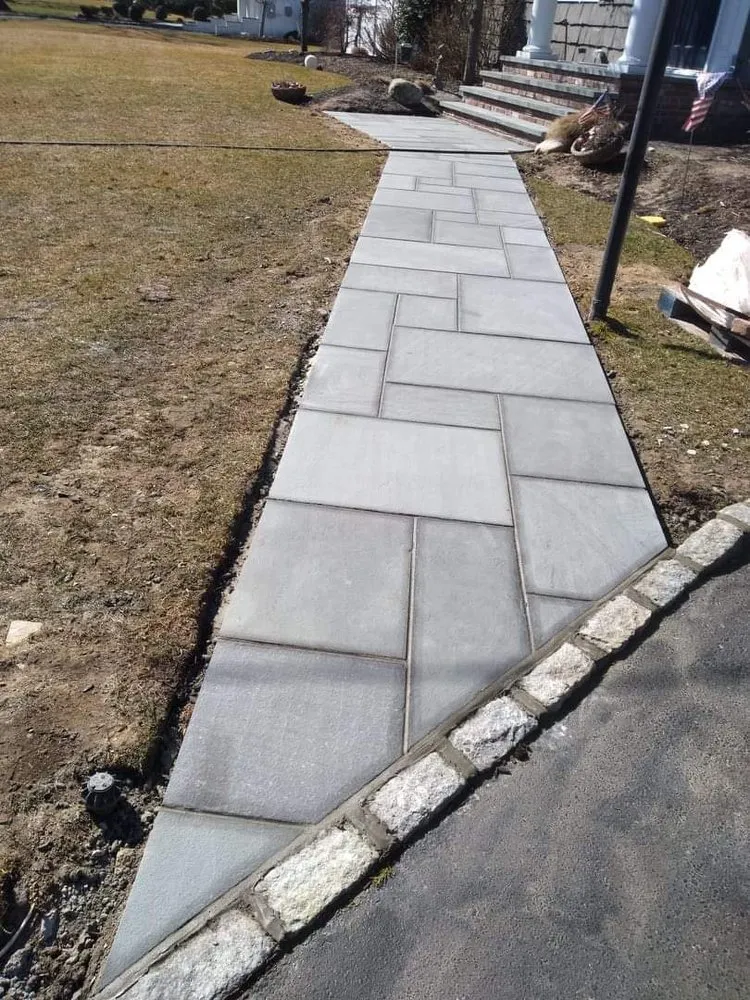 Professional yard cleanup service for outdoor upgrades in Ronkonkoma, NY by EZ Mason and Concrete