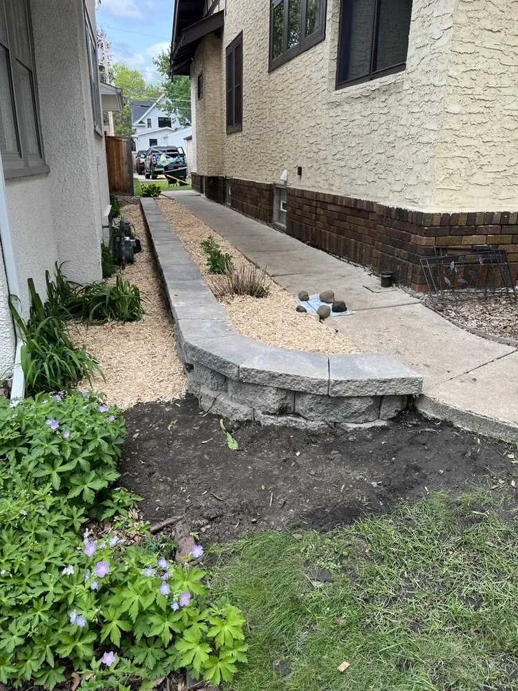 Professional landscape installation for year-round maintenance in Minneapolis, MN by EZ Outdoor Services