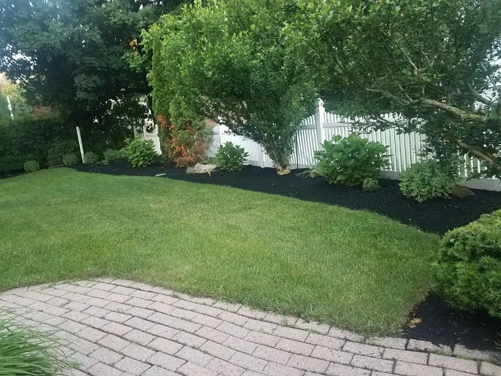 Affordable lawn mowing service for homes in Worcester, MA by Fabiano Landscape Masonry