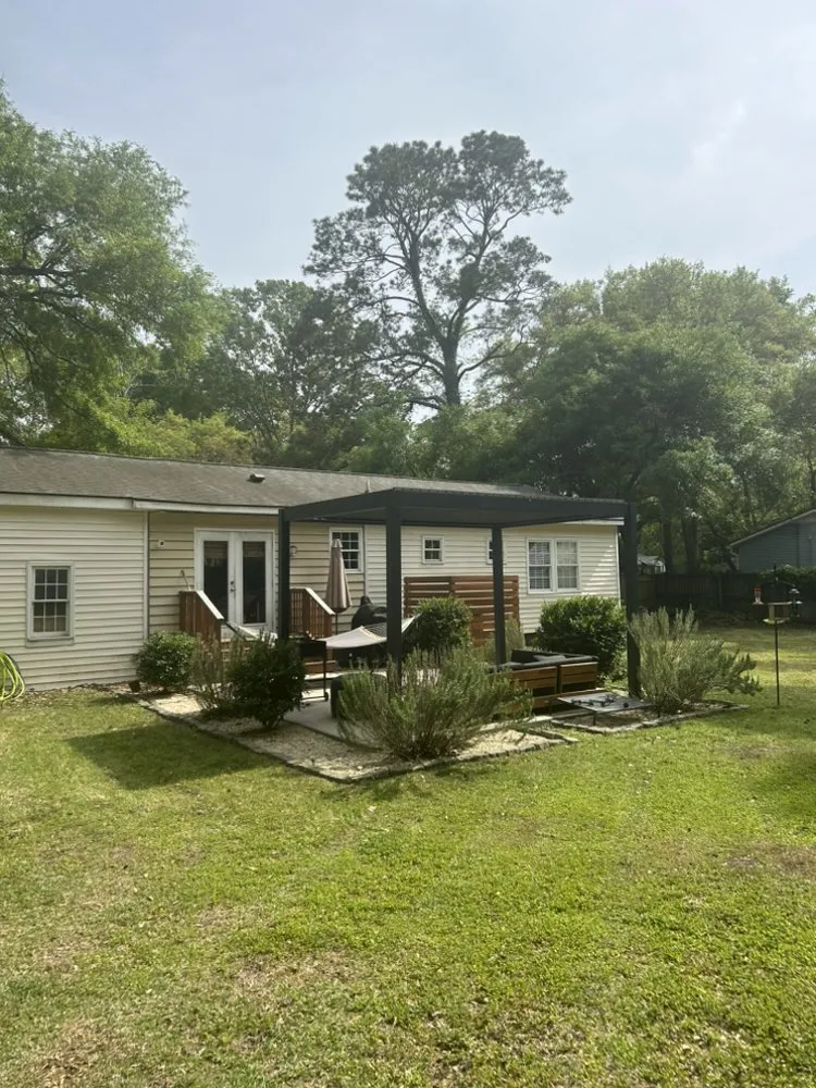 Custom landscape installation with custom design in Ravenel, SC by Fair Kare Cuts & Trims